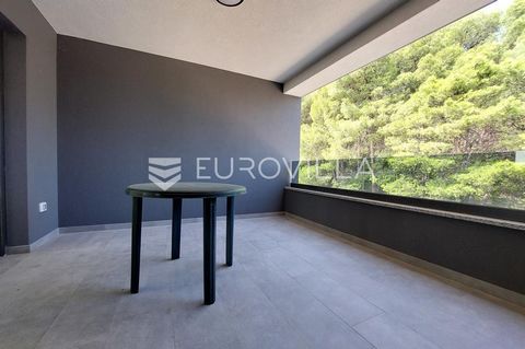 This top-quality apartment is located on the second floor of a smaller residential building. It consists of a hallway, a spacious living room with a kitchen and dining room access to a covered terrace with a view of the forest, three bedrooms (one wi...