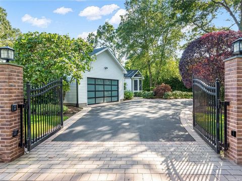 As you enter the gated driveway of 23 Old Country Road in East Quogue, you are immediately greeted and captivated by the variety of mature plants and landscaping that surround one of the most meticulously maintained homes you have ever been in. Offer...