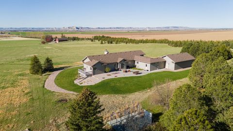 Located in Scottsbluff, Nebraska, Western Nebraska Executive Farm and Hunt consists of 95.48 +/- acres furnished with a beautiful custom home, productive irrigated hay fields, a wooded creek that runs throughout the property, and a well maintained po...