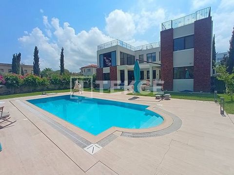 Detached Villa with Pool and Garden in a Site in Çatalköy Girne Girne Çatalköy is one of the most popular residential areas in Northern Cyprus and is an ideal area especially for those looking for a quiet life. In this area where mountain and sea vie...