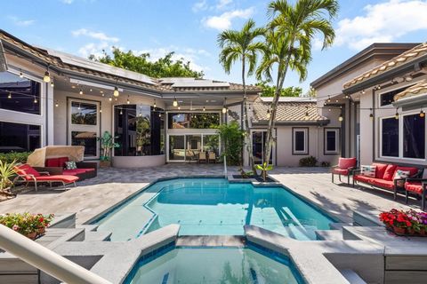 Set on an oversized 17,049 SF lot, this nearly 5,000 SF single-story estate offers unmatched lifestyle and location in Seasons-Boca's premier east-of-441 gated enclave. With a newer roof, upgraded air conditioners, and fully paid solar panels, this r...
