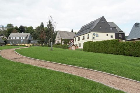 This huge, spacious, and luxurious 14-bedroom holiday home in Deutschneudorf rests in the middle of the Ore Mountains. It has a surrounding green garden with a children's playground and a grill for the evenings. You can stay here with a total of 32 p...