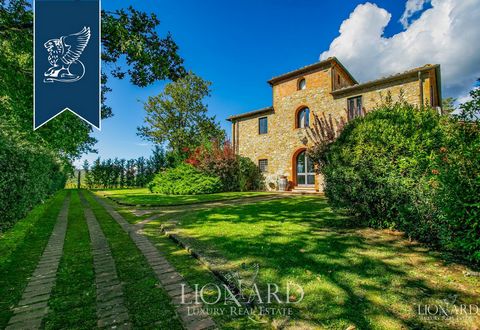 Near Bucine, in the province of Arezzo, there is this luxury farmhouse with breathtaking views of Tuscany's leafy countryside for sale. The villa is surrounded by 7,400 sqm of land consisting of a private garden featuring patio with a jacuzzi an...