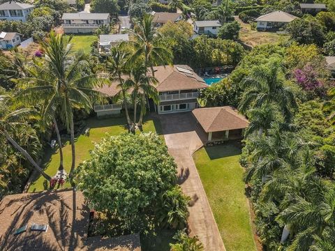 3365 Akala Drive is a wonderful surprise as you come through the gate! Take in the lush tropical landscaping, three water features and rock walls on this almost acre lot that afford privacy and a sense of tranquility. Add to it a gorgeous shower tree...