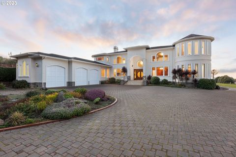 Welcome to your own slice of paradise on the beautiful Oregon coast! This Spanish-style estate in Yachats is a peaceful, park-like retreat that boasts approximately 225 feet of ocean frontage, providing a breathtaking backdrop to your daily life. Rem...