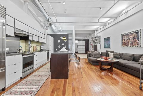 Authentic SoHo Loft Living Awaits on Coveted Cobblestone Street in between Prince and Spring Street- The heart of SoHo! Enjoy a luxurious loft lifestyle in this stunning 2-bedroom, 2-bathroom co-op with the tallest ceilings in the building. Nestled o...