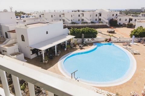 Located in Costa Teguise, this spacious apartment features 2 bedrooms for 4 people. Suitable for families, guests can take a dip in the shared swimming pool and access free WiFi at this child-friendly property near the beach. You can walk down to the...