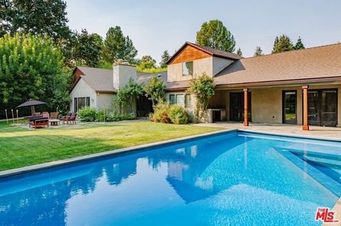 This stunning modern ranch home on a flat acre exudes a charm and style that is both rustic and refined. With its pool and spa, lean-to horse shelter with corral, creek and vineyard, the property offers a relaxing escape and spacious private sanctuar...