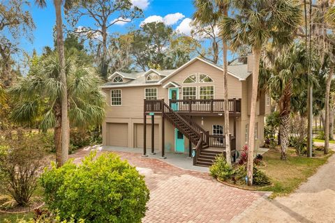 Welcome to this waterfront oasis! UNIQUE is the description with this fully renovated home that offers TWO parcels! One is located on a salt water canal and equipped with a dock, kayak launch and solar powered boat lift allowing access to the GULF OF...