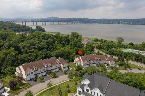 Welcome to 2601 Sylvan Loop located in the sought after Overlook Pointe community offering Hudson River views, privacy, a 3650 sq ft end unit with abundant natural light. The first floor offers an open concept living and dining room with vaulted ceil...