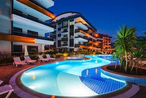 ALANYA/OBA DANS UN SITE DE LUXE 1.1 KM DE LA MER -1+1 Cuisine américaine -80 m2 -1 WC douche - 4e étage -Année de construction 2018 Piscine extérieure et intérieure -Préposé au site, Espace barbecue Kamelya, Ascenseur, Sauna, Fitness, Bain turc, Géné...