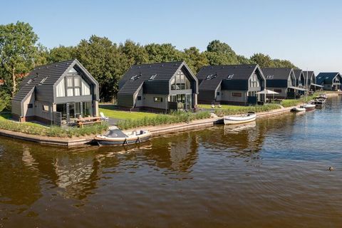 This luxurious holiday home with its own jetty in Balk, Frisian, is very suitable for holidays with the family. The house is located on a small-scale villa park with a direct connection to the Frisian Slotermeer. The water villa has a spacious living...