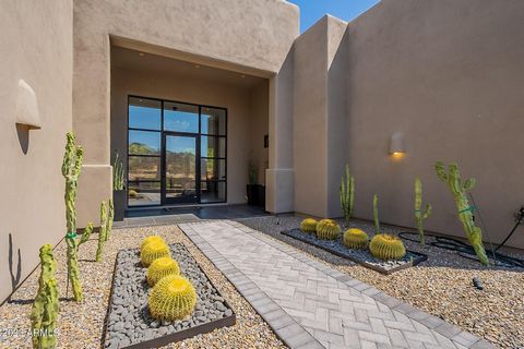 Troon mountain views are to be seen! 4 bedroom, 4.5 bath, custom home in Troon Village. Remodeled, stunning, single-level. All bedrooms are ensuite. Contemporary floor to ceiling entry door & fabulous crystal chandelier. Great room open to chef's kit...