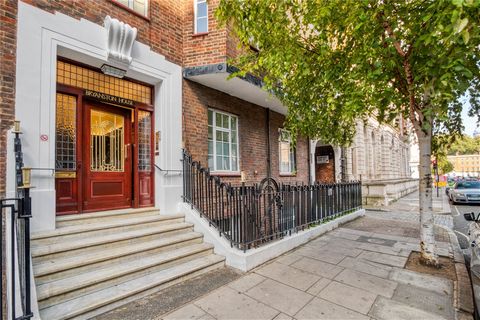 Offered with the always sought after Share of Freehold is this sizeable three bedroom flat comprising of over 1,000 sq ft of living space. Set on the lower ground floor of this early 20th century portered mansion block with lift, the apartment benefi...