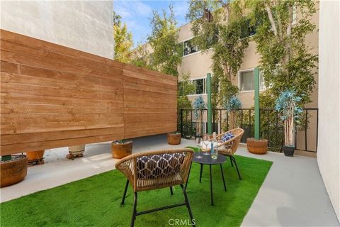 Tucked away on a quiet back corner and elevated off the street, this stylishly reimagined condo offers the perfect blend of modern comfort and convenience. The spacious living and dining area boasts pristine Vintage White Oak hardwood flooring, reces...