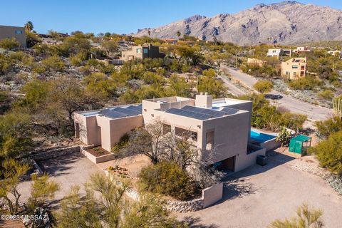 Magnificent MOUNTAIN VIEWS of the Catalina's seen throughout the home. Simply breathtaking. Private setting on almost an acre surrounded by natural desert. If you desire there is room to grow. Wonderful multi level floor plan with Primary suite on it...