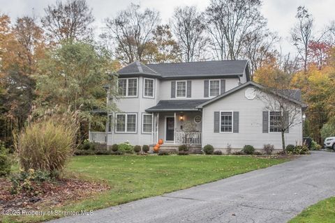 Lake rights at beautiful Lake Kahagon! Exquisite Contemporary Colonial home situated on a private 1 acre lot adjoining state game land. North Pocono School District. Three bedrooms, 2.5 baths, completely updated with 3 levels of living space. Feature...