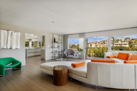 A few blocks from the beach and in nearly 4,000 square feet, this Mid-Century modern residence has been extensively updated. Situated far above the street on a private driveway in the Bluffs of Playa Del Rey, the home is flooded with light and envelo...