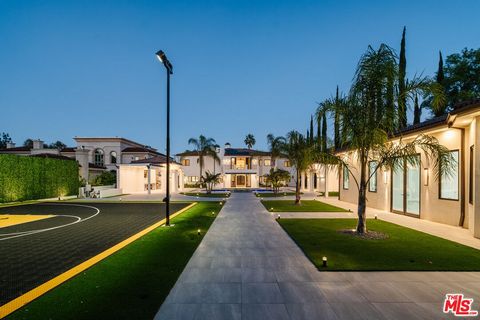 Welcome to The Aura Estate. Offering a secure and gated master-planned estate, this expansive residence sits on a serene cul-de-sac in Tarzana's highly coveted flats, south of the Boulevard. Surrounded by prestigious estate homes, the property boasts...