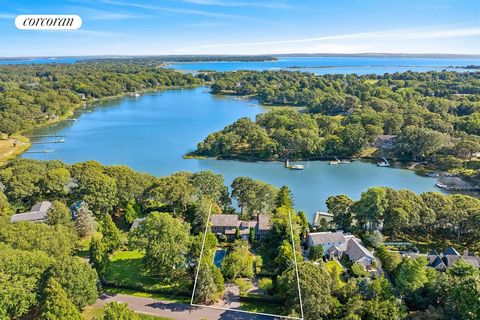 This exquisite, totally renovated waterfront home spares no expense. Beautifully designed and constructed, this 4 bedroom, 5 bath home has lovely cutting gardens that bloom throughout the year. With 113 feet of waterfront, a beautiful stone patio wit...