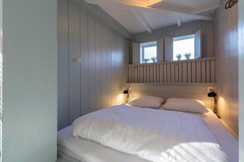 Cozy Coastal Retreat Nestled at the edge of Duinland Park, this charming bungalow offers a warm, family-friendly atmosphere just a short walk from the beach. The inviting living space features thoughtful decor and a unique built-in box bed that doubl...