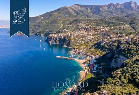 In the town of Vico Equense, near Sorrento, there is this stunning villa for sale. This property measures 260 sqm and has two floors. On the ground floor we find a living room connected to a dining area with an open-plan kitchen with access to a sple...
