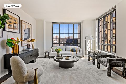 This large two-bedroom apartment in one of DUMBO's most desirable boutique buildings offers an exceptional living experience. Enter through a full entry foyer into a spacious main area with impressive 10-foot ceilings, finished with elegant 5