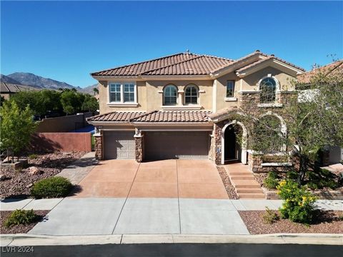 WELCOME TO THE HIGHLY SOUGHT AFTER ALLERTON PARK COMMUNITY LOCATED IN THE HEART OF SUMMERLIN! WALK INTO HIGH VAULTED CEILINGS, BEAUTIFUL TRAVERTINE TILE, LIKE-NEW SHUTTERS, FRESH PAINT THROUGHOUT, AND FINISHES YOU WON'T WANT TO MISS! THIS GOURMET KIT...