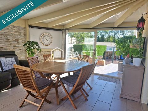 Maison avec veranda, garages et terrain