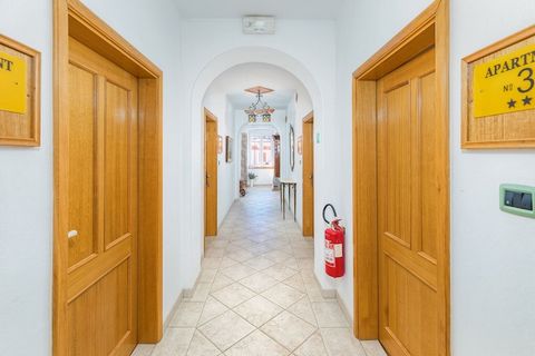 This inviting apartment accommodates up to 6 guests with two cozy bedrooms featuring single beds and a sofa bed in the common area. It offers a spacious layout with a dining table next to a convertible bed for added flexibility. A large shared terrac...