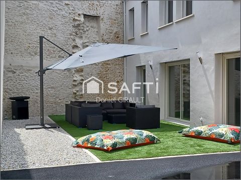 Située à Saujon, cette maison bénéficie d'un emplacement central et pratique, offrant un cadre de vie agréable à proximité des commodités