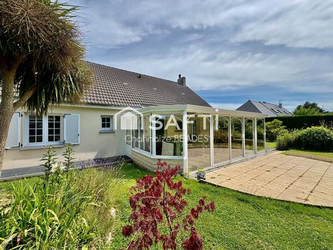 Maison avec grande véranda et terrain arboré