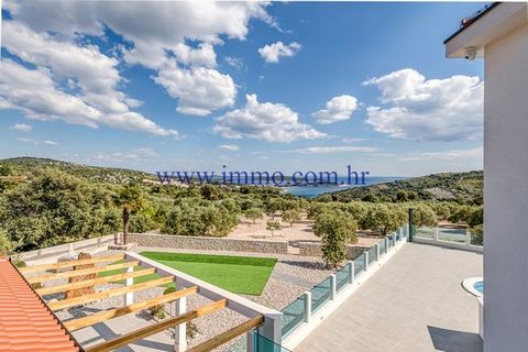 For sale luxury holiday home with sea view near Rogoznica. It is located on a hill that offers amazing views of the sea, islands and sunset, and is only a few minutes walk from the crystal clear sea and beautiful pebble beach. House has two floors co...