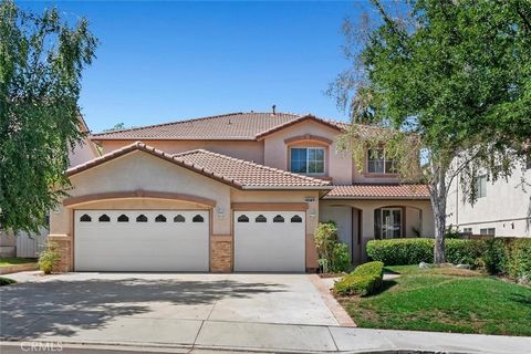 Discover your dream home in the coveted Stevenson Ranch community! This exquisite 3,395-square-foot residence combines comfort and elegance, featuring a entirely freshly painted interior with newly renovated flooring in the upstairs bedrooms and both...