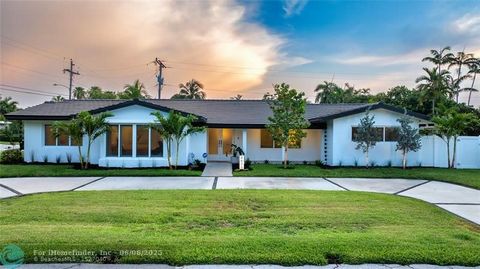 Experience refined living in this exceptional Coral Ridge Ranch residence. Fully renovated and expanded, this turnkey home sits on an oversized corner lot surrounded by lush landscaping and mature fruit trees. Light-filled interiors feature porcelain...