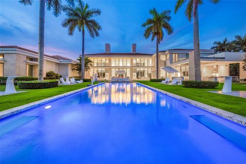 Discover the epitome of modern luxury in this 2017-built residence spanning over 13,600 sq ft of living space. An architectural masterpiece with a massive open floor plan, it boasts 6 spacious bedrooms, 6 full bathrooms, and 2 half baths. Set on an e...