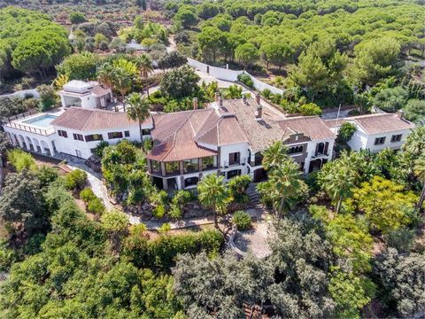 This unique property is located in Alhaurin el Grande part of a private gated community in beautiful surroundings overlooking the valley of Guadalhorce. The villa offers 7 large bedrooms with en suite bathrooms, 6 guest bedrooms with bathrooms, two s...