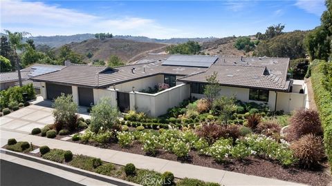 Nestled in the prestigious Mission Hills Ranch community, this striking, contemporary single-story residence sits on a premium oversized lot, offering a tranquil retreat with direct access to extensive bridal and hiking trails in San Juan Capistrano....