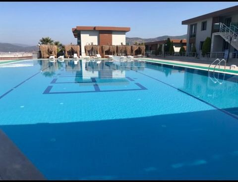 Hotel concept flats in Milas  Furnished Ready to move  Swimming pool Lake & Sea  view close to Beaches close to hotels 10 min. to Milas airport  Great nature is surrounded Villa concept Great for holiday visits Opportunity prices Features: - Air Cond...