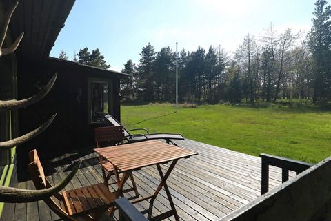 Holiday home located at the end of a cul-de-sac in Vejers up to a larger plantation on a large plot in very quiet surroundings. The cottage is cosily furnished with wood burning stove, open kitchen and living room. Not for rent to youth groups. A ref...