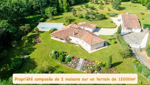 Propriété comprenant deux habitations sur un terrain magnifiquement arboré d'environ 12000m² avec piscine couverte.