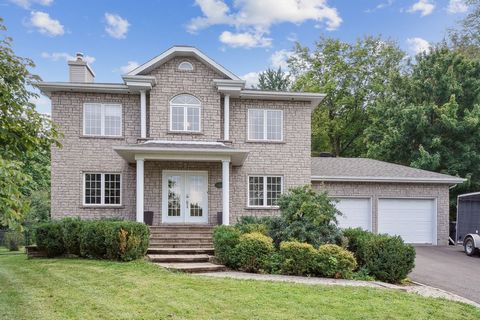 Superb bright two-story house on 18,030 sq. ft. landscaped land backed by a forest strip, including an above-ground swimming pool. This house offers 5 bedrooms, 2 bathrooms and a powder room, a gas fireplace in the living room and a slow combustion s...