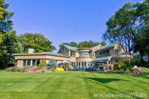 Discover an unparalleled waterfront lifestyle in this magnificent Lake Macatawa property nestled along the serene shores of Holland, Michigan. With its over 200 feet of pristine lake frontage and panoramic views from nearly every room. This home was ...