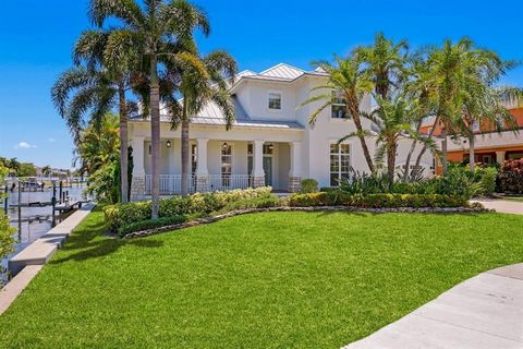 Newly Remodeled ISLAND OASIS in the Tranquil coastal community of MiraBay. Masterfully renovated, in this sought-after location, and located on one of the LARGEST saltwater canal lots in Mirabay. Featuring unobstructed water views, a rarely found hal...