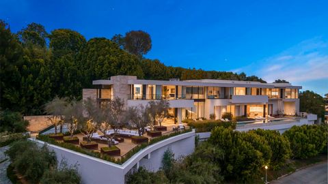 Ideally located in one of the most sought-after enclaves of lower Bel Air, this Mediterranean-contemporary estate was finished in 2020 and boasts spectacular unobstructed city-to-ocean views. Encompassing 15,000 square feet of contemporary architectu...