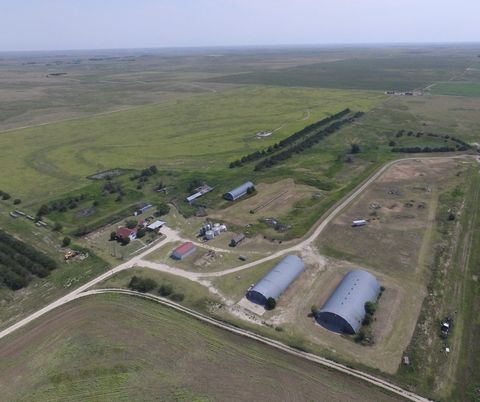 Attention farmers and ranchers! This 32 acre farmstead located in western Ness County, Kansas is one you don't want to miss out on! This property offers a massive amount of shed space and is highlighted by 3 large outbuildings. These buildings are pe...