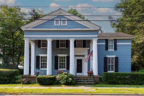 In the Village of Rhinebeck sits a 1830's Greek Revival residence full of grace and heritage. Behold the grandeur of 2-story fluted columns adorning the entrance, an understated yet stunning feature. Inside discover an impressive 11-room layout boast...