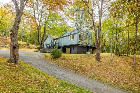 Welcome to The Treehouse, a contemporary home hidden amongst the trees on 9 acres and overlooking a tranquil swimming pond and dock. As you drive up the winding driveway, you are met with clerestory windows and a dramatic sawtooth roof, which was des...