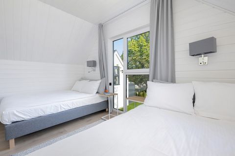 Enjoy a perfect beach getaway in this charming 70 m² holiday home in Trzęsacz, Poland, just 100 meters from the sandy shore. Situated next to the Hotel Wellness & Spa, it offers privacy with hotel comforts. The two-story home sleeps 3 guests with two...