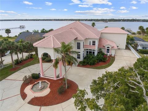 ALMOST 1 ACRE DIRECT DEEP WATER INTRACOASTAL WATERFRONT with approximately 140ft Halifax River frontage! This luxurious estate boasts 9,513 sf of living space, and sits on a large, double lot. As you enter through the private gate you will circle to ...